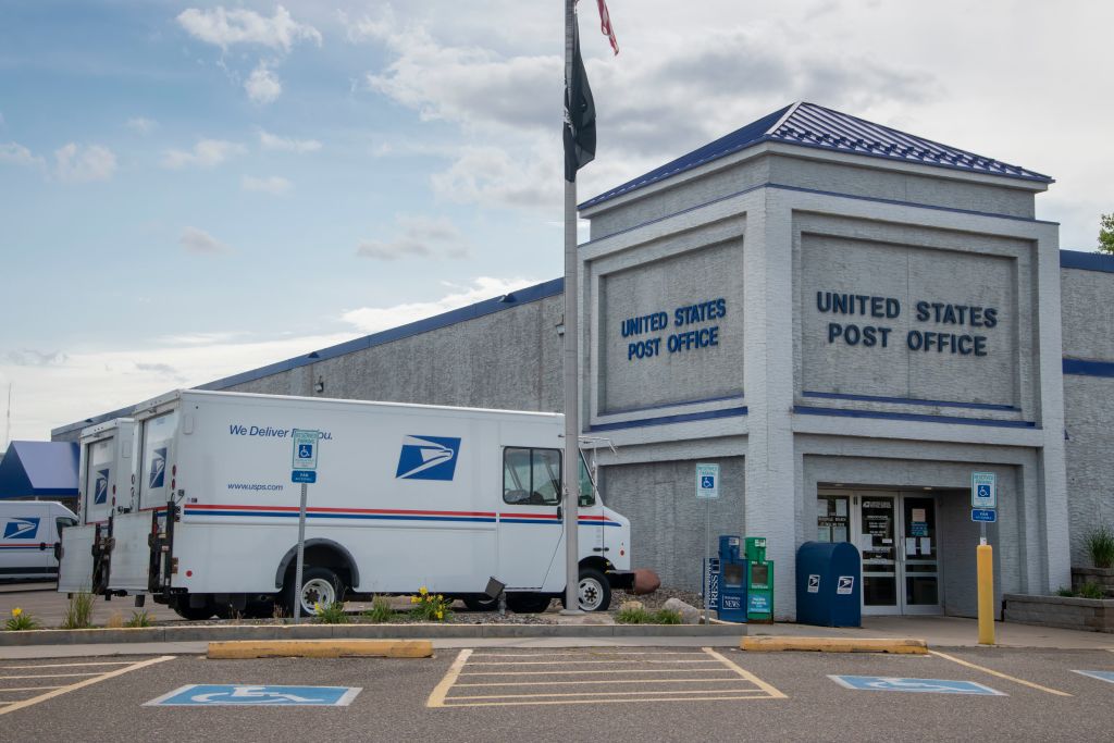 United States Post Office, Mail delivery trucks parked at post office, Roseville, Minnesota.