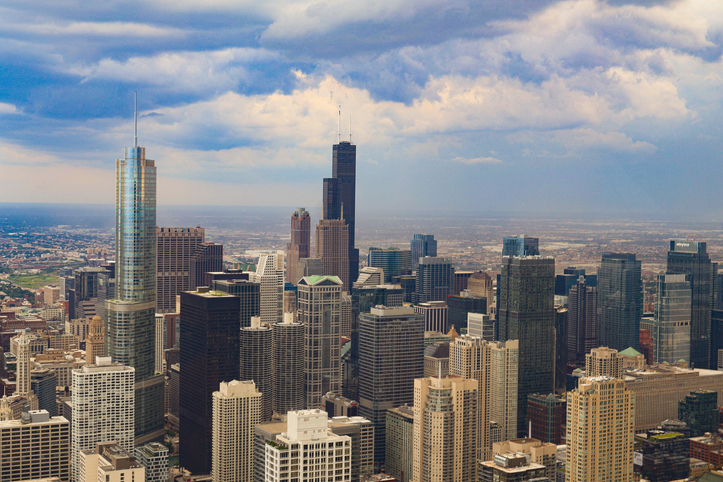 Aerial view of buildings in city against cloudy sky,Chicago,Illinois,United States,USA